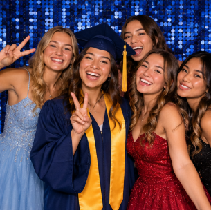 Friends posing together during a school celebration